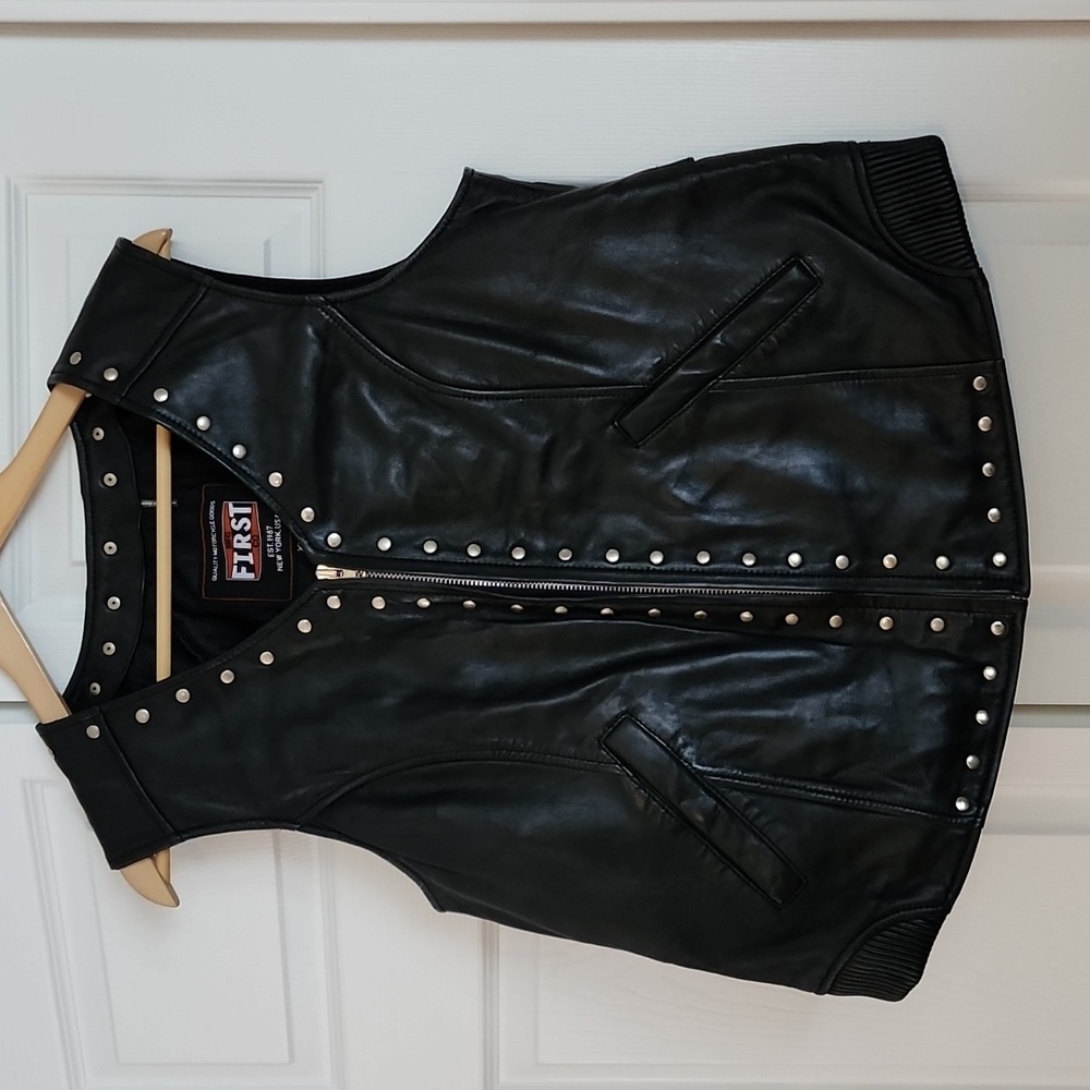 Woman's First Mfg Co Black Leather Vest with studs and ribbon tie back. Size 2X